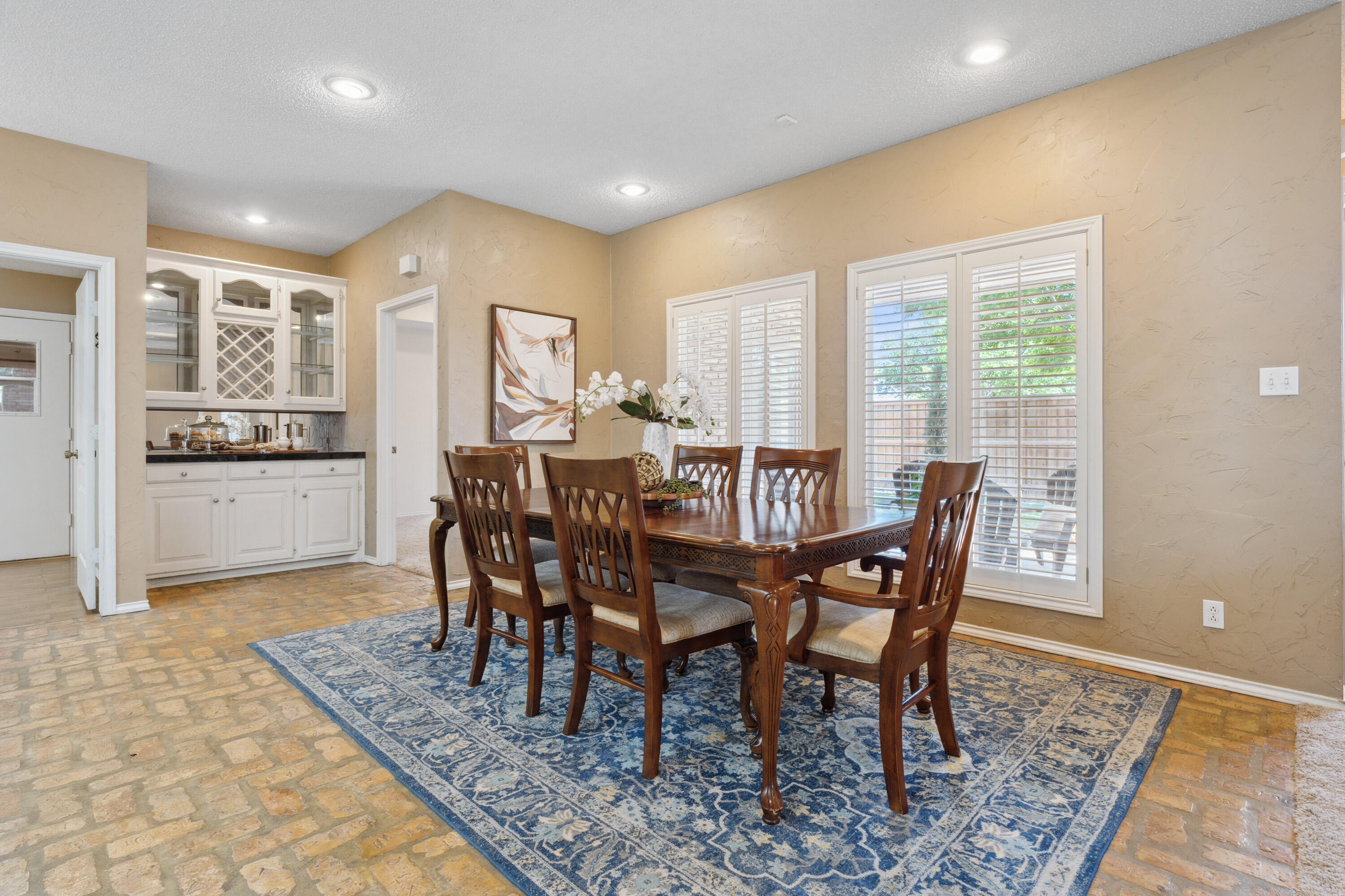 102 North Utica Avenue Lubbock, TX 79416 - Photo 10 of 36 a view of a dining room with furniture