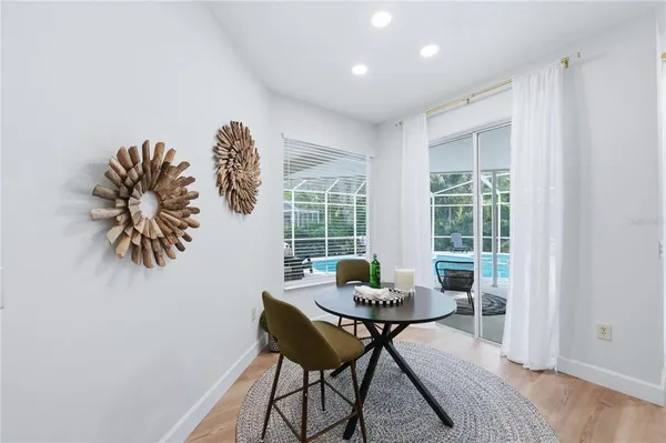 a dining room with furniture and window
