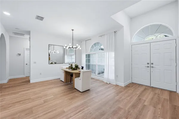 a view of a room with wooden floor