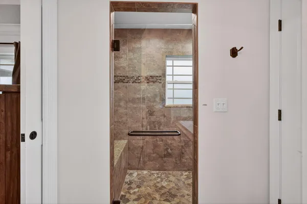 a bedroom with a bed and window