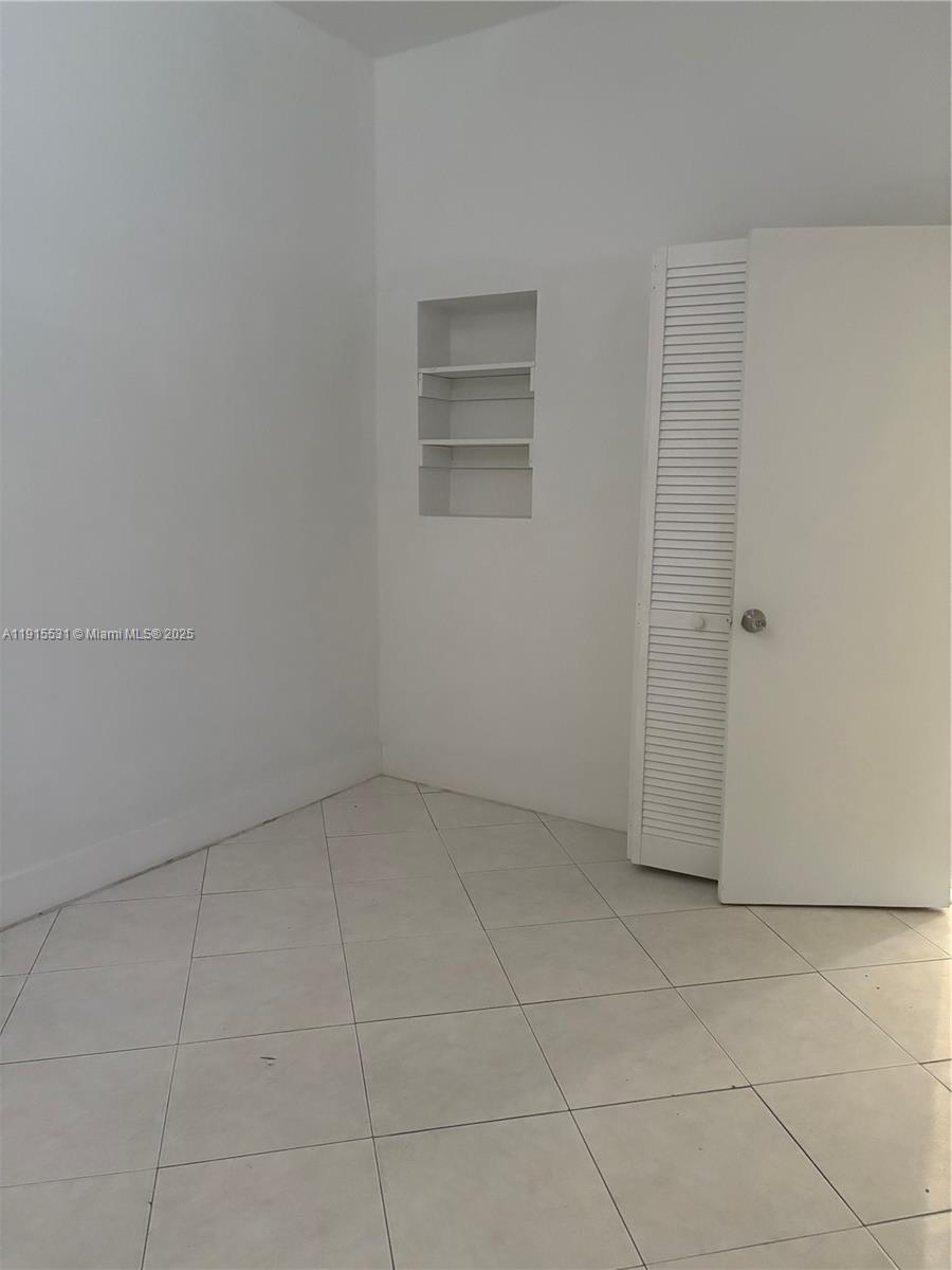 927 Southwest 9th Avenue, Unit 1 Miami, FL 33130 - Photo 11 of 16 an empty room with a empty space
