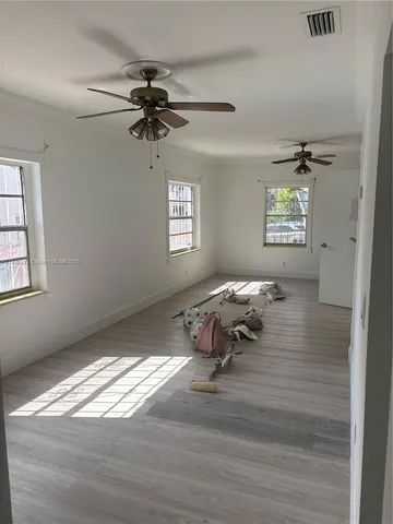 a living room with couch and a window