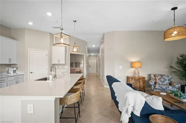 a dining room with furniture and a chandelier