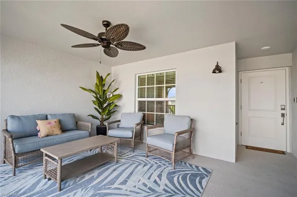 a living room with furniture and a window