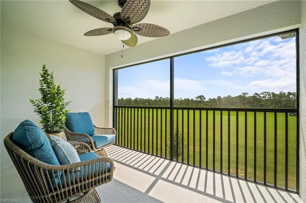 a view of balcony with furniture