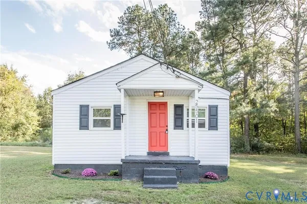 a front view of a house with yard
