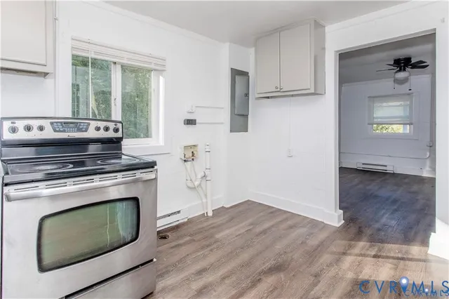 a kitchen with a stove and a microwave