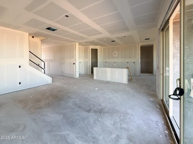 a view of a big room with closet and windows