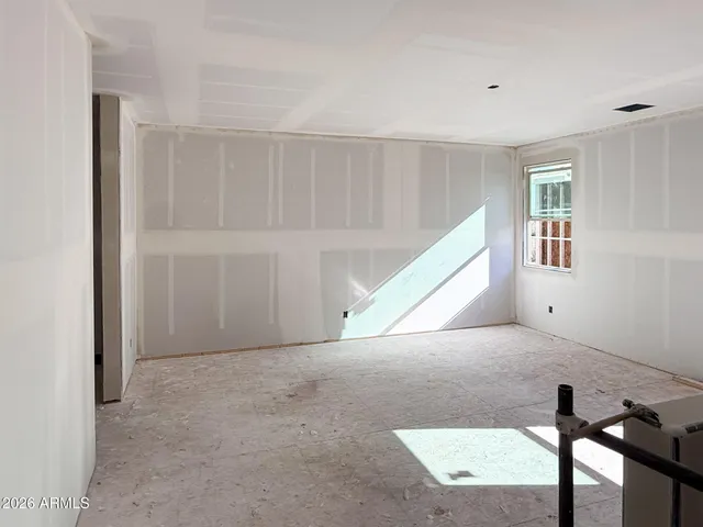 a view of an empty room with windows