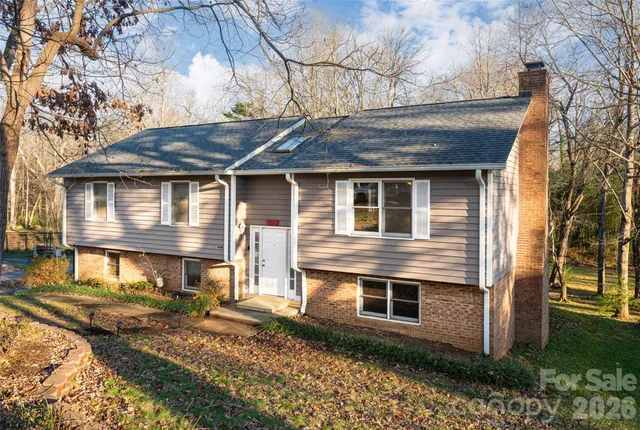 a living room with furniture and a large mirror
