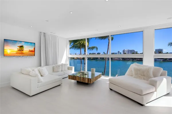 a spacious bedroom with a bed and a couch