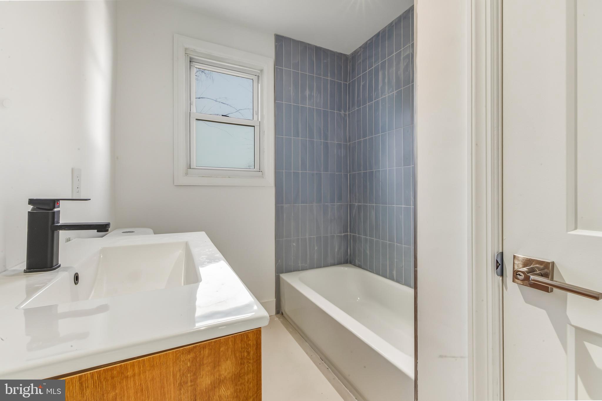 3 Farndale Road Somerdale, NJ 08083 - Photo 11 of 14 a bathroom with a tub and a sink