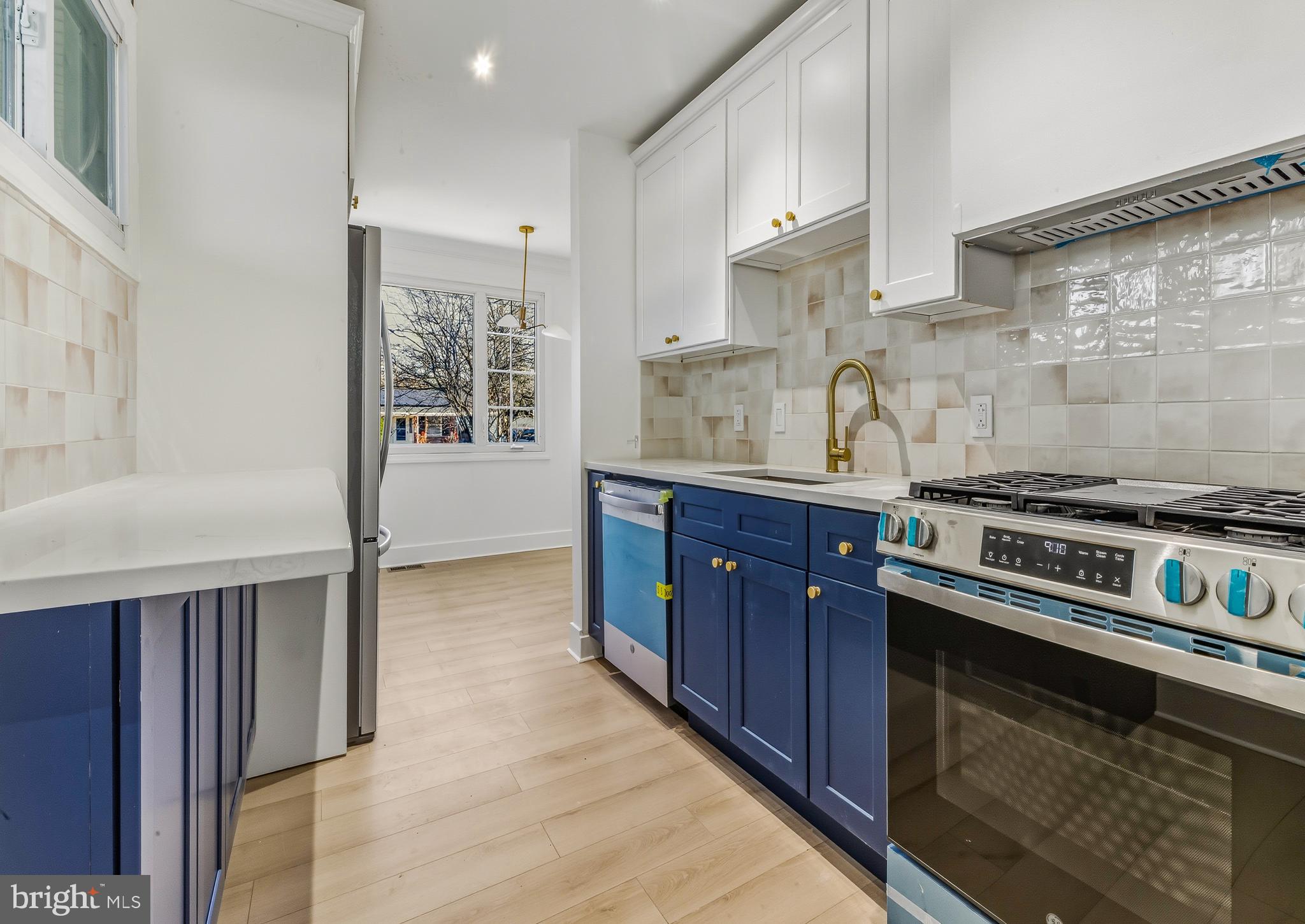 3 Farndale Road Somerdale, NJ 08083 - Photo 6 of 14 a kitchen with a stove and a sink