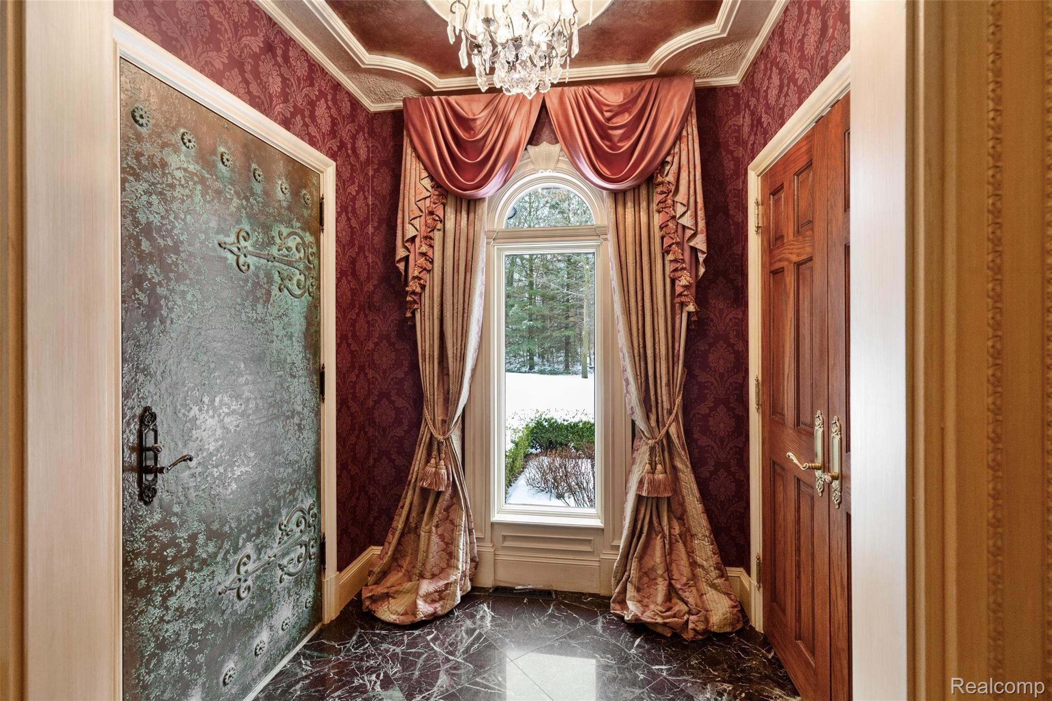 9715 North Eston Road Clarkston, MI 48348 - Photo 4 of 51 Stunning foyer with solid bronze entry door.