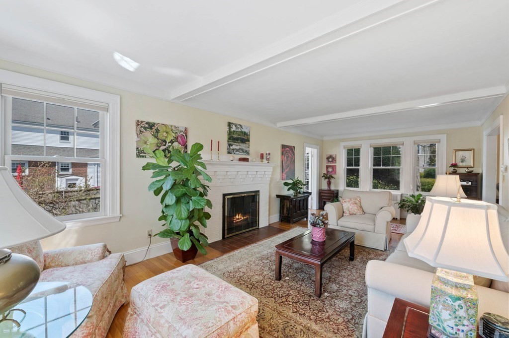 28 Columbia Road Marblehead, MA 01945 - Photo 15 of 42 a living room with furniture potted plant a fireplace and a window