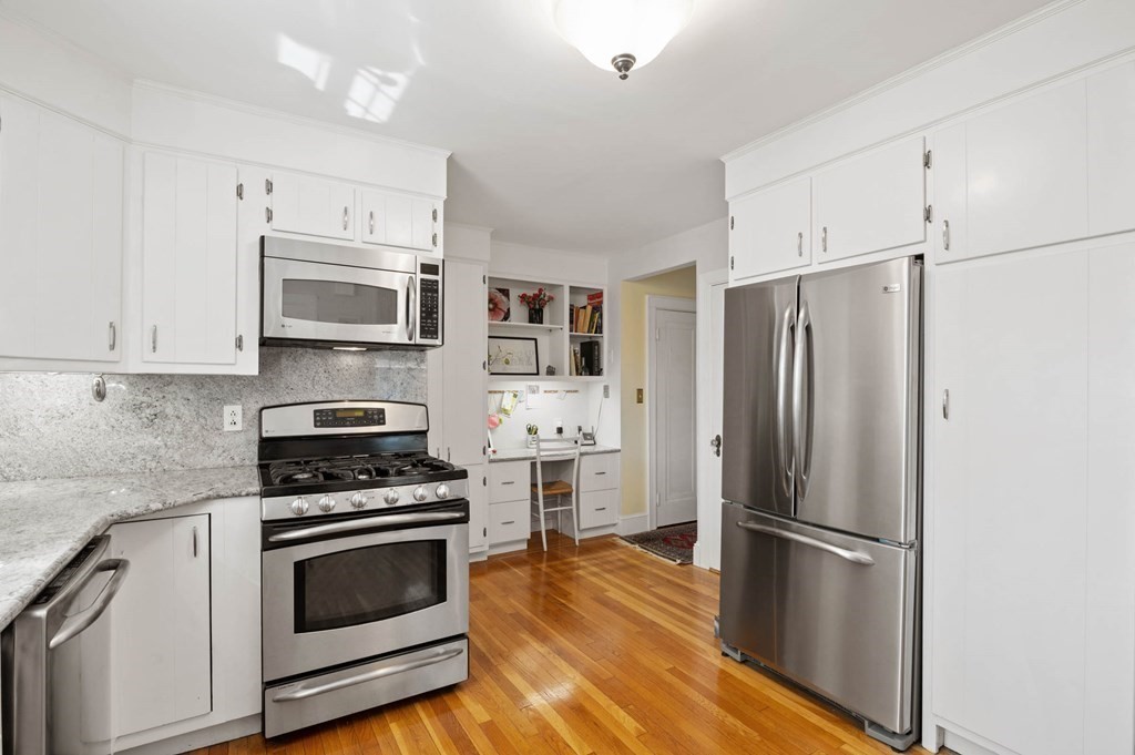 28 Columbia Road Marblehead, MA 01945 - Photo 20 of 42 a kitchen with stainless steel appliances a refrigerator sink and microwave
