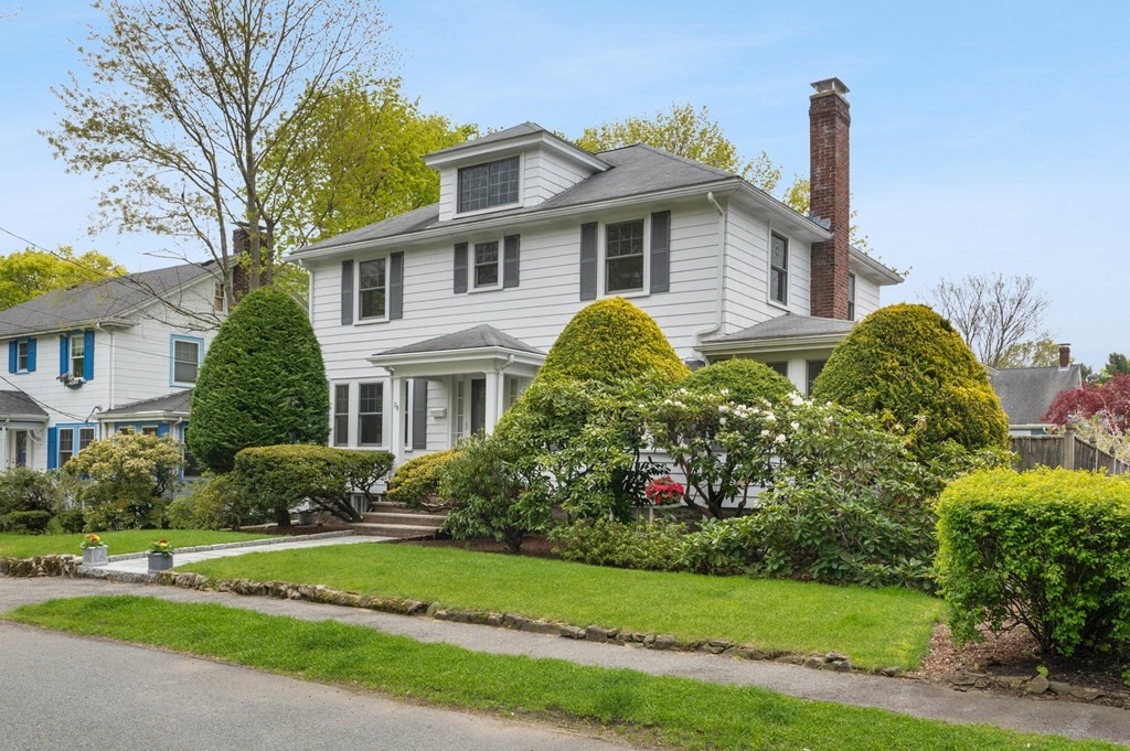 28 Columbia Road Marblehead, MA 01945 - Photo 2 of 42 a front view of a house with a yard and potted plants