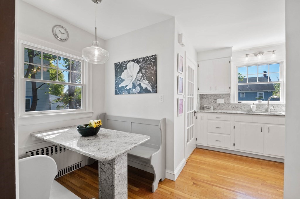 28 Columbia Road Marblehead, MA 01945 - Photo 22 of 42 a kitchen with a sink a window and chairs