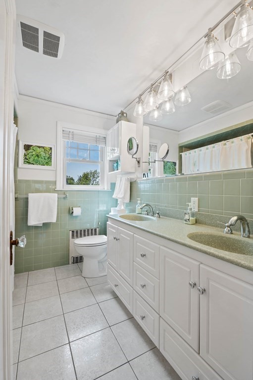 28 Columbia Road Marblehead, MA 01945 - Photo 29 of 42 a spacious bathroom with a granite countertop sink a toilet and a mirror