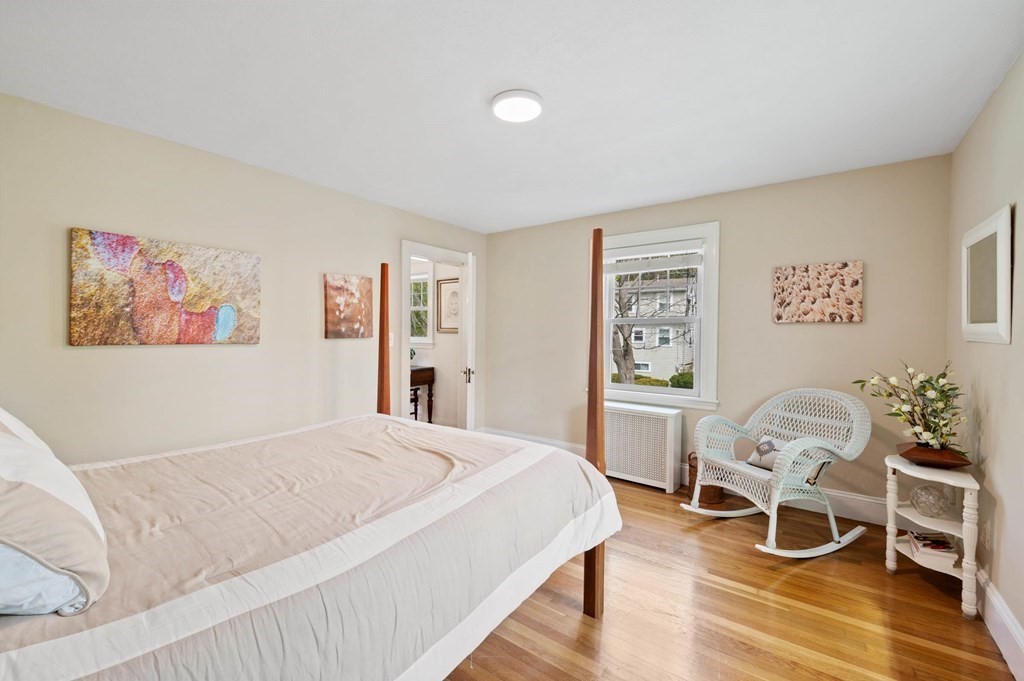 28 Columbia Road Marblehead, MA 01945 - Photo 36 of 42 a bedroom with a bed and a chair
