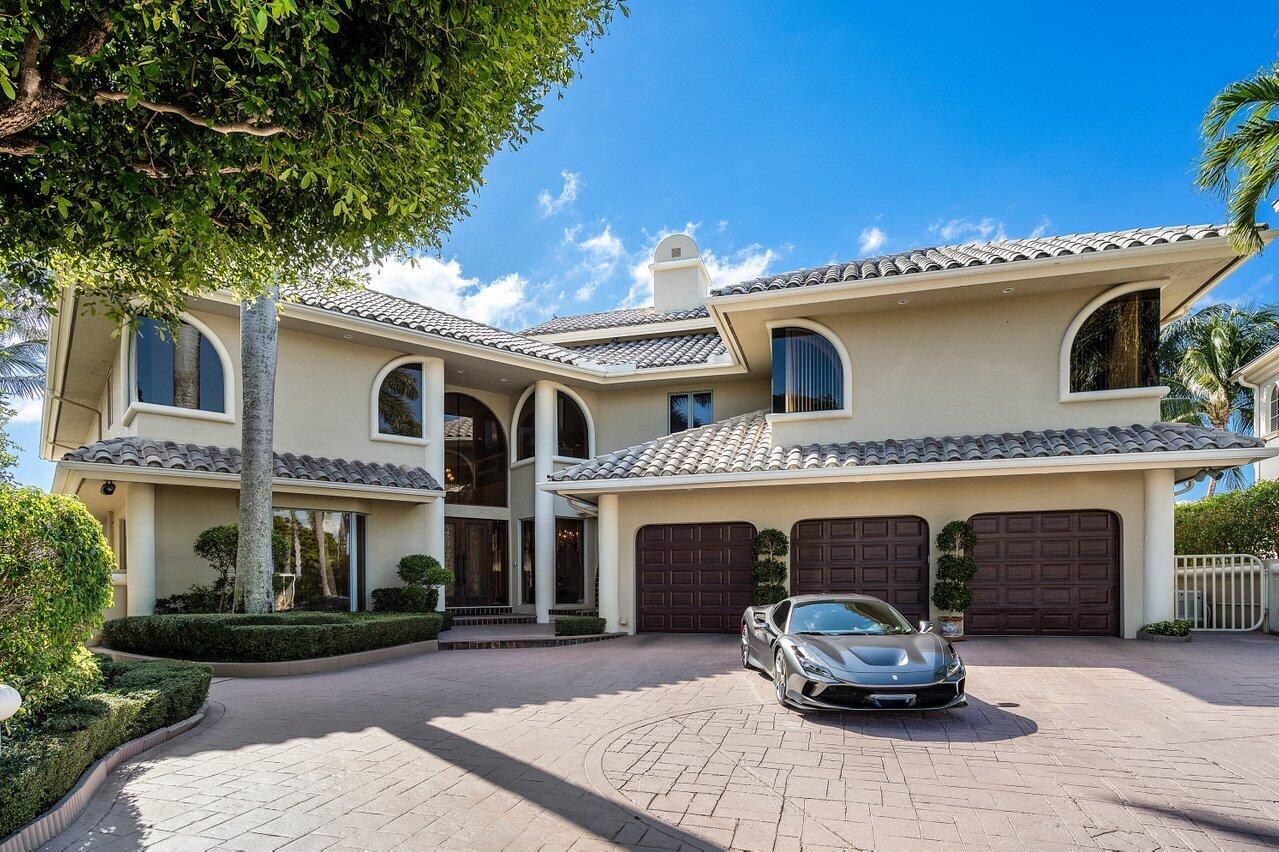 750 Tern Point Circle Boca Raton, FL 33431 - Photo 1 of 81 a front view of a house with a garden