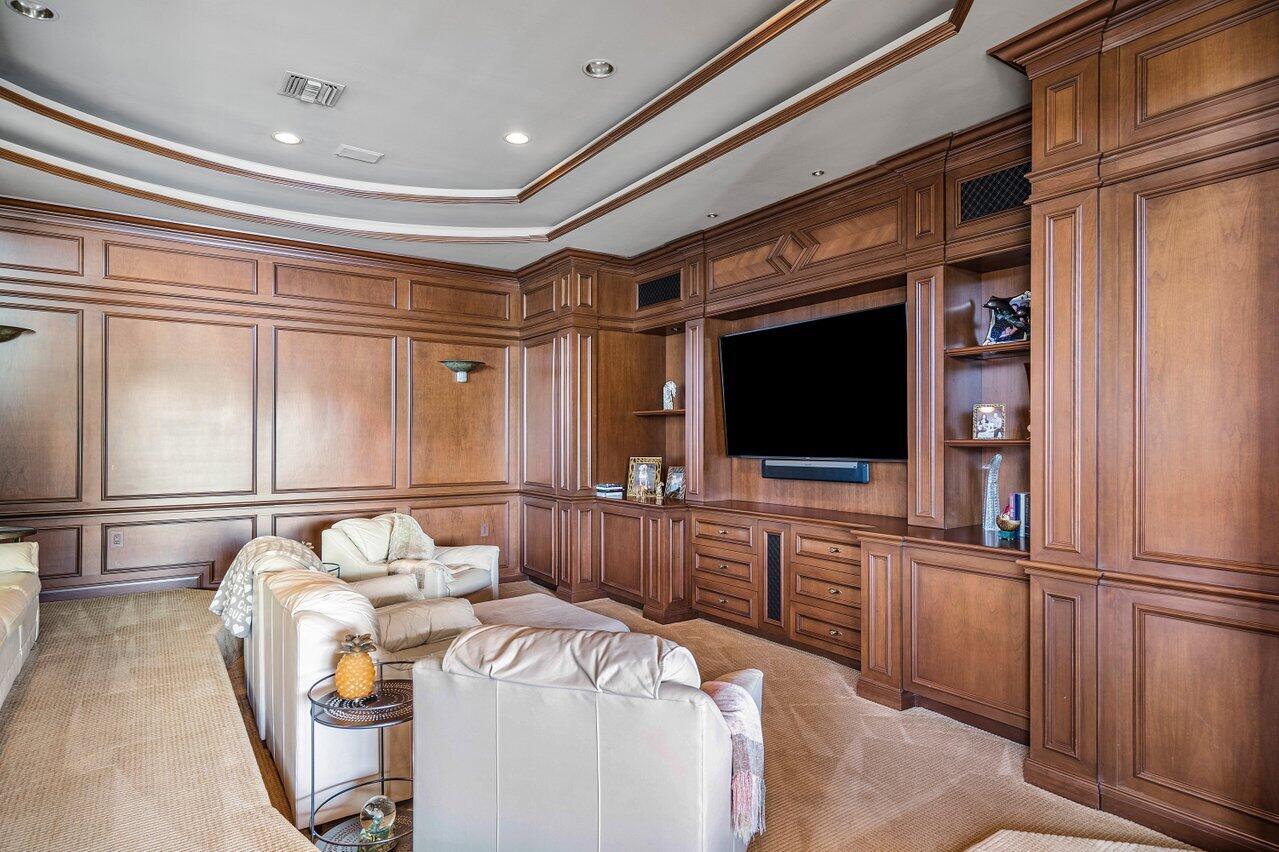 750 Tern Point Circle Boca Raton, FL 33431 - Photo 12 of 81 a living room with furniture a flat screen tv and a refrigerator