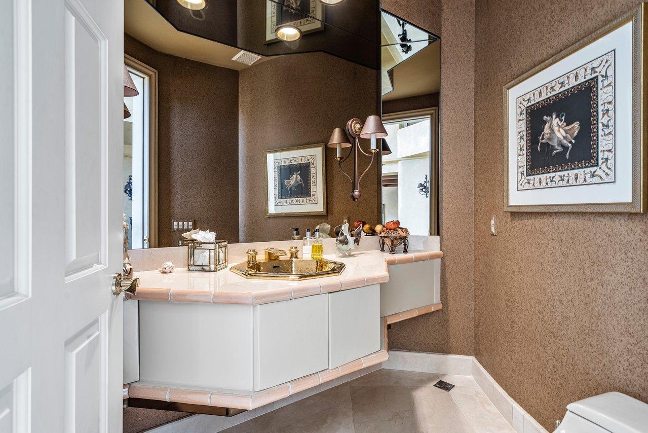 750 Tern Point Circle Boca Raton, FL 33431 - Photo 14 of 81 a bathroom with a sink mirror and toilet