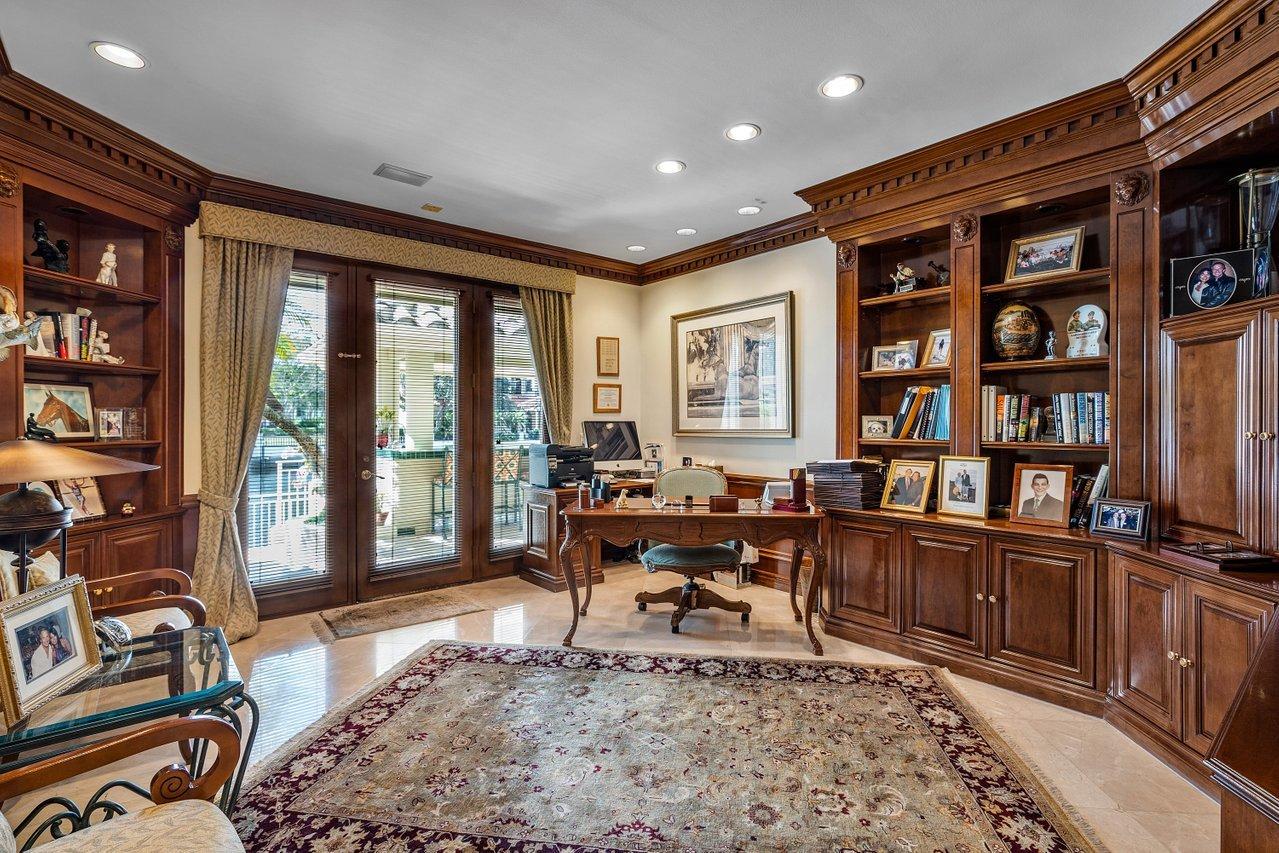 750 Tern Point Circle Boca Raton, FL 33431 - Photo 20 of 81 a living room with furniture a rug and a book shelf