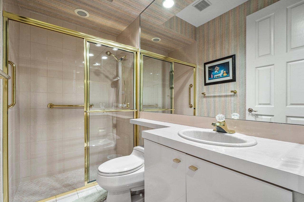 750 Tern Point Circle Boca Raton, FL 33431 - Photo 22 of 81 a bathroom with a sink toilet and shower