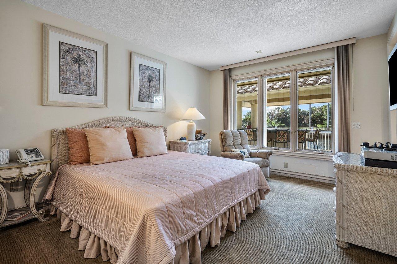 750 Tern Point Circle Boca Raton, FL 33431 - Photo 24 of 81 a spacious bedroom with a bed and a large window