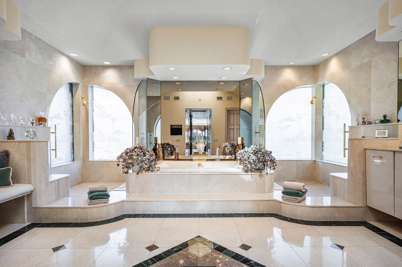 750 Tern Point Circle Boca Raton, FL 33431 - Photo 32 of 81 a large bathroom with a double vanity sink and a mirror