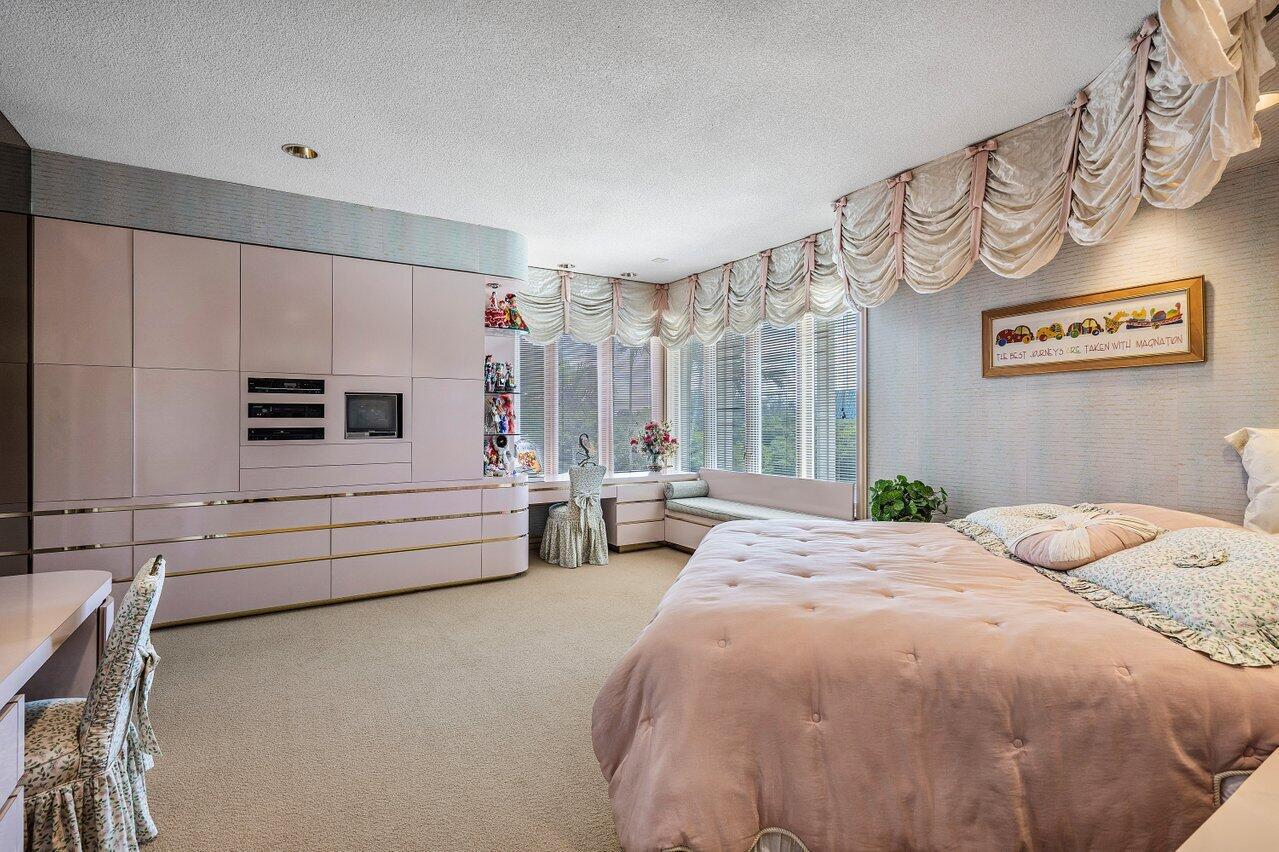 750 Tern Point Circle Boca Raton, FL 33431 - Photo 37 of 81 a bed room with a bed and a chair