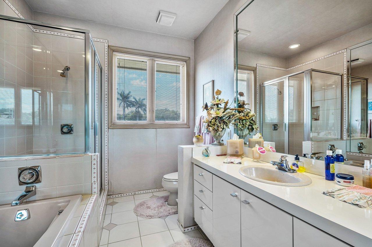 750 Tern Point Circle Boca Raton, FL 33431 - Photo 38 of 81 a bathroom with a double vanity sink toilet and shower