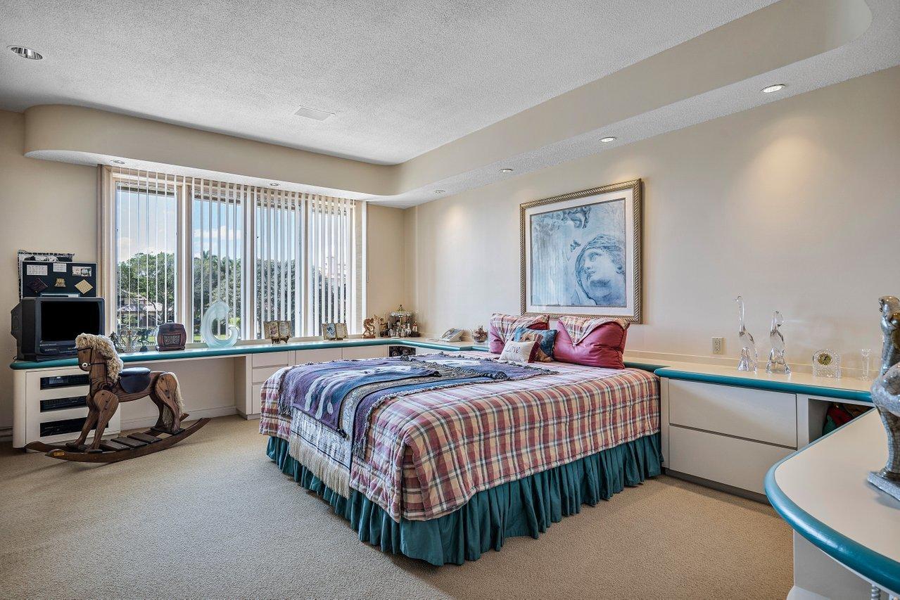 750 Tern Point Circle Boca Raton, FL 33431 - Photo 39 of 81 a bedroom with a bed and a couch