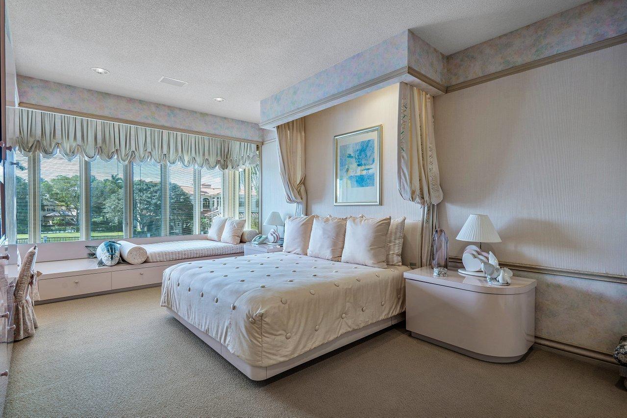 750 Tern Point Circle Boca Raton, FL 33431 - Photo 41 of 81 a bedroom with a bed and a large window
