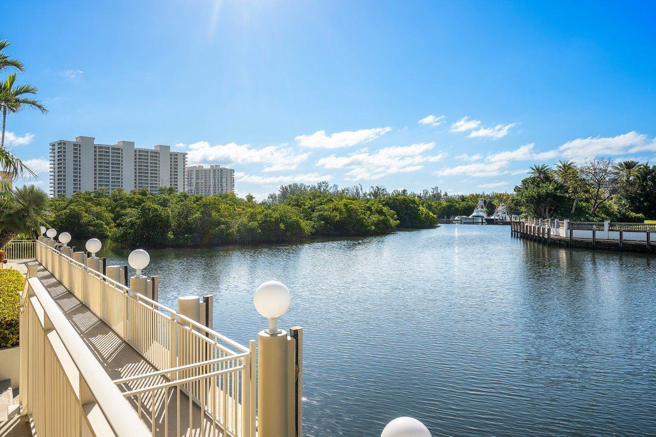 750 Tern Point Circle Boca Raton, FL 33431 - Photo 60 of 81 a view of a lake with a large building in the background