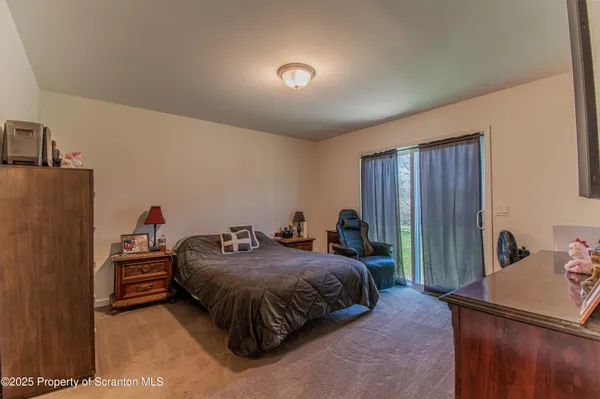 a bedroom with a bed and a closet