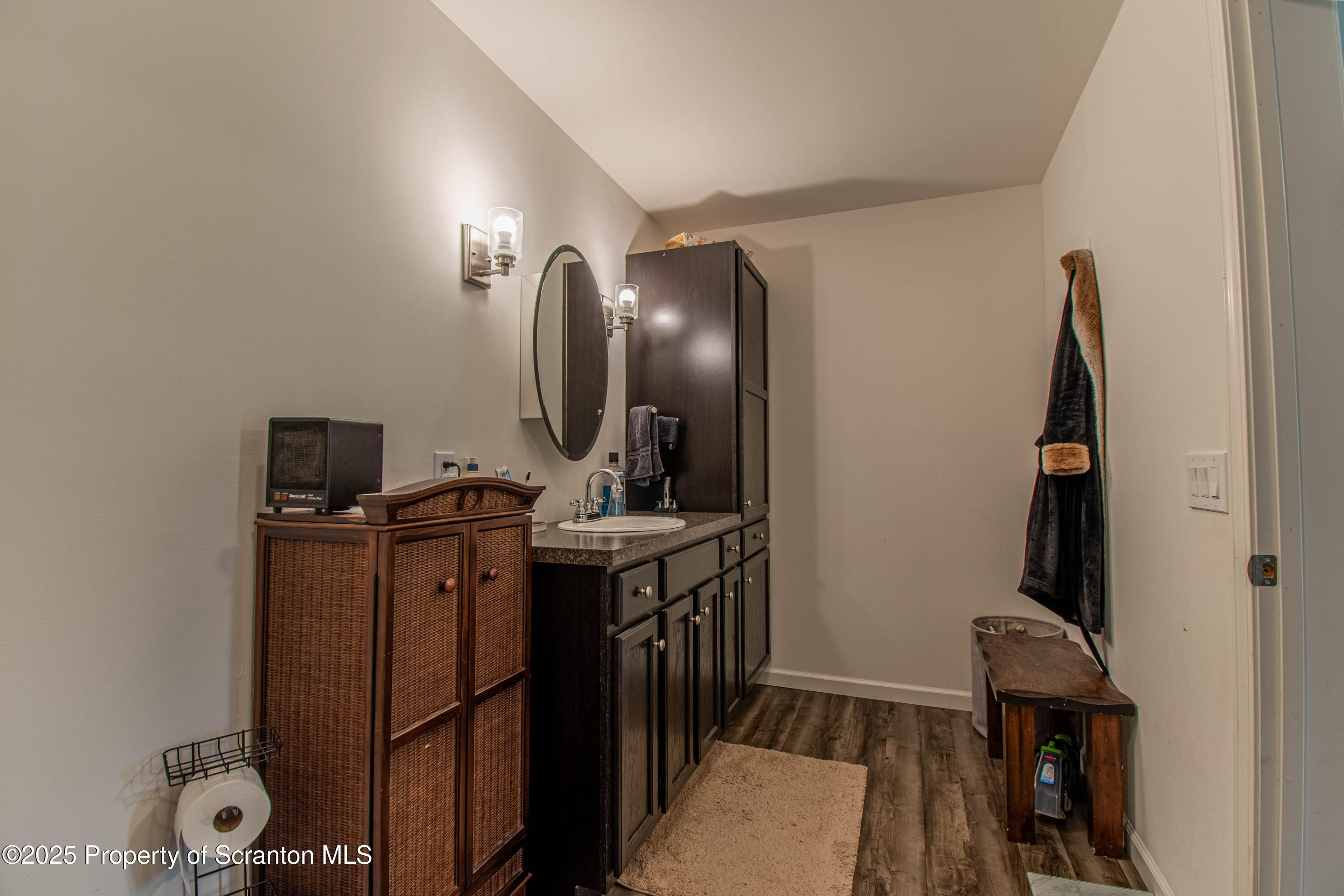 151 Sandy Banks Road Carbondale, PA 18407 - Photo 20 of 36 a bathroom with a sink and a mirror