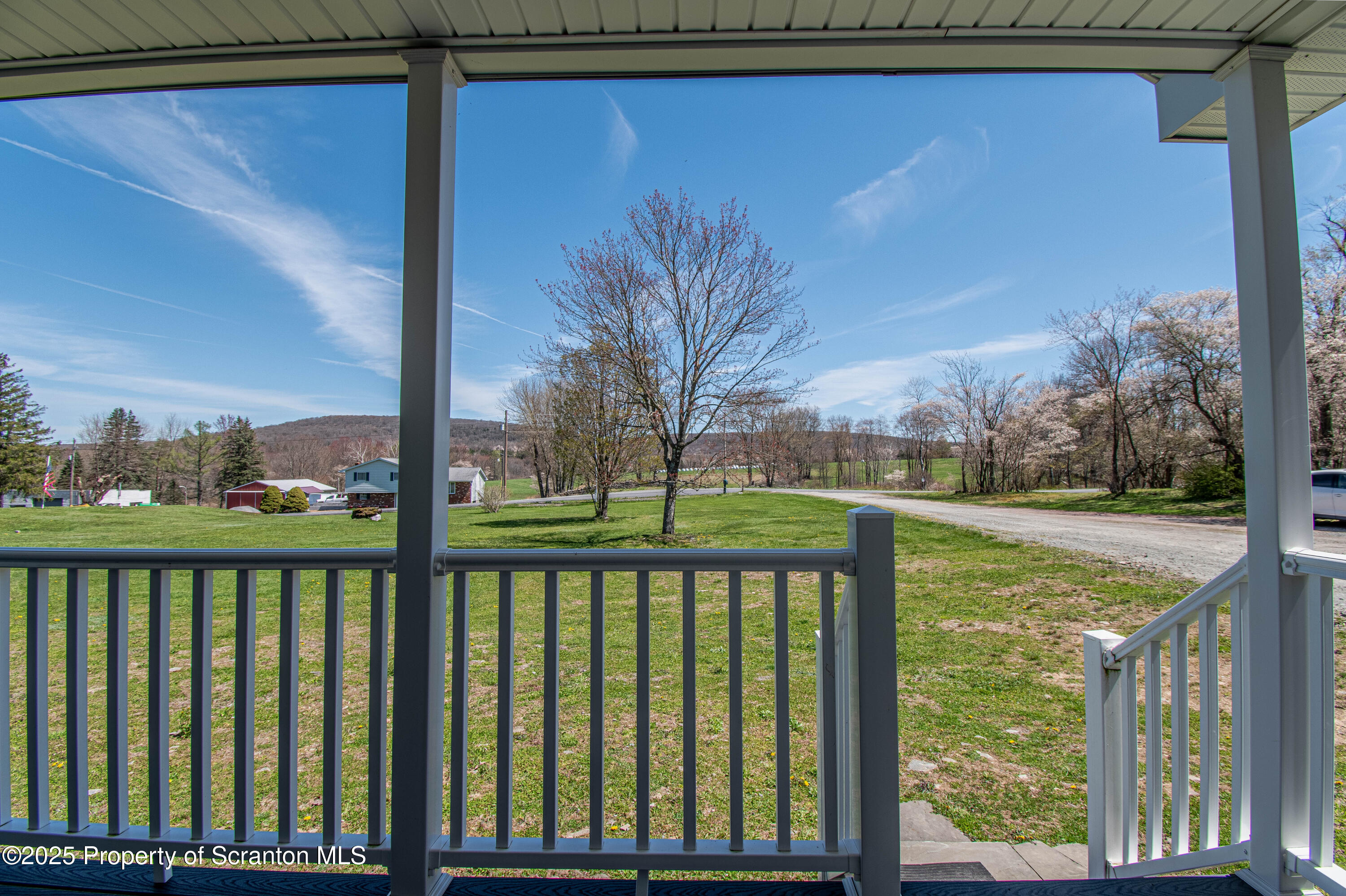 151 Sandy Banks Road Carbondale, PA 18407 - Photo 2 of 36 a view of a balcony with trees