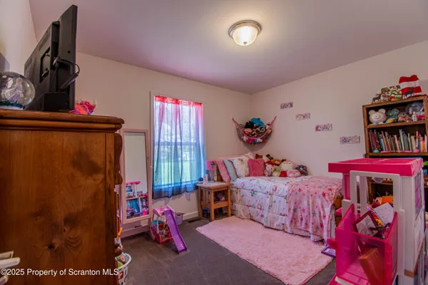a living room with lots of furniture and a flat screen tv