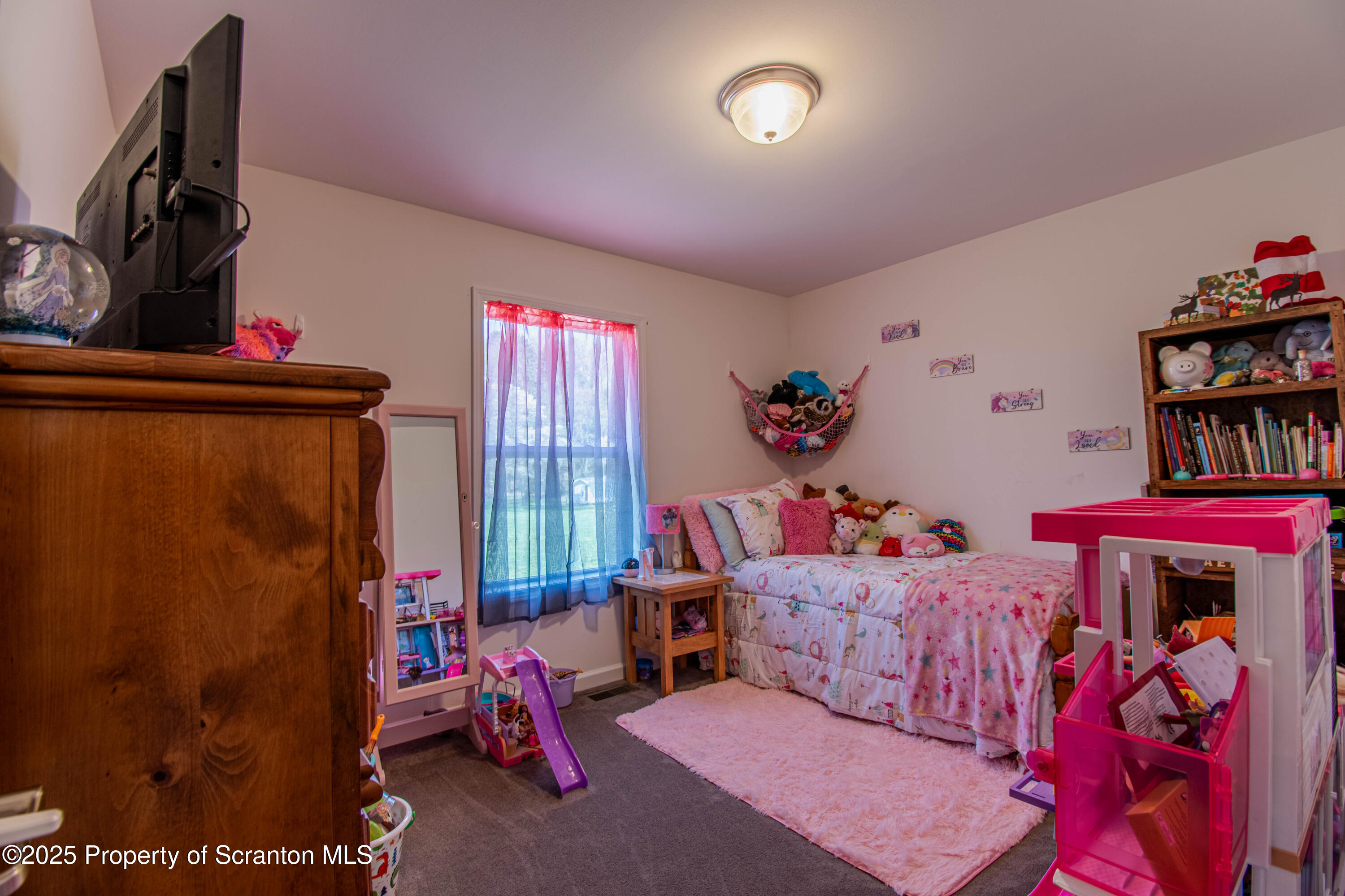 151 Sandy Banks Road Carbondale, PA 18407 - Photo 21 of 36 a living room with lots of furniture and a flat screen tv