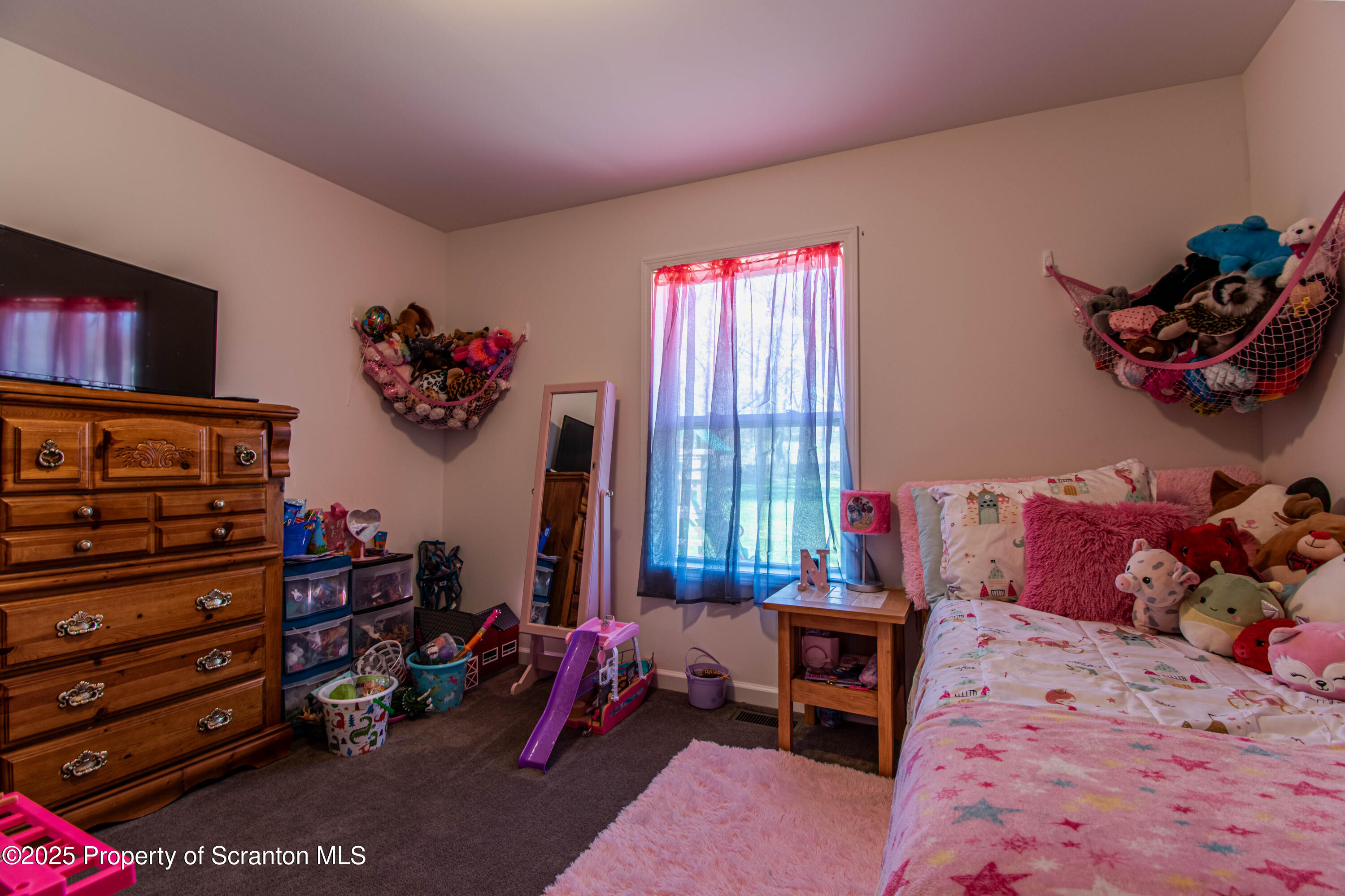 151 Sandy Banks Road Carbondale, PA 18407 - Photo 22 of 36 a bed room with a bed and a couch