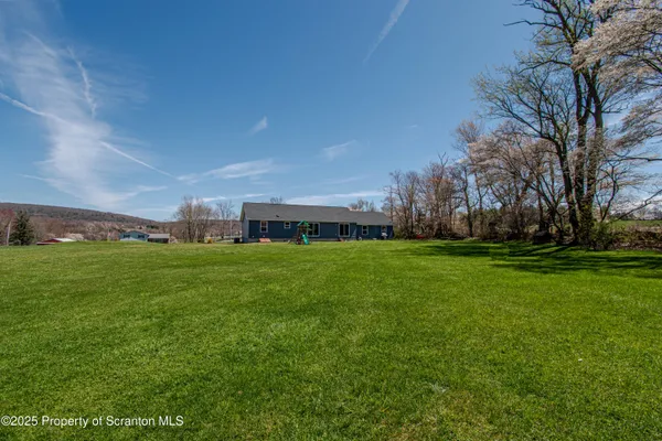 a view of a building with a big yard