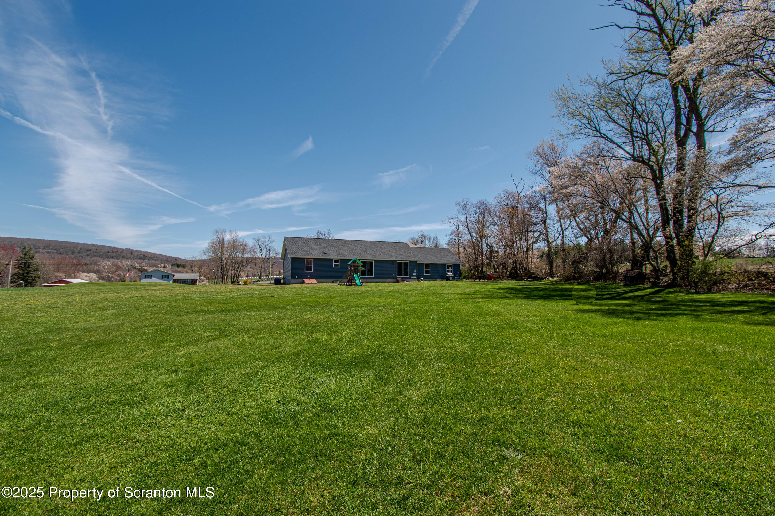 151 Sandy Banks Road Carbondale, PA 18407 - Photo 3 of 36 a view of a building with a big yard