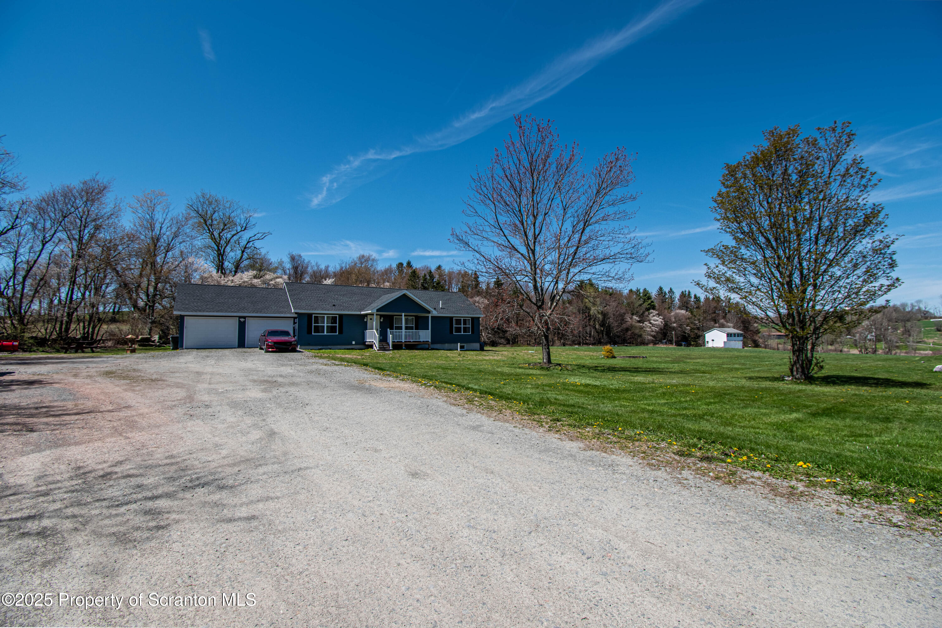 151 Sandy Banks Road Carbondale, PA 18407 - Photo 32 of 36 a view of a house with a yard