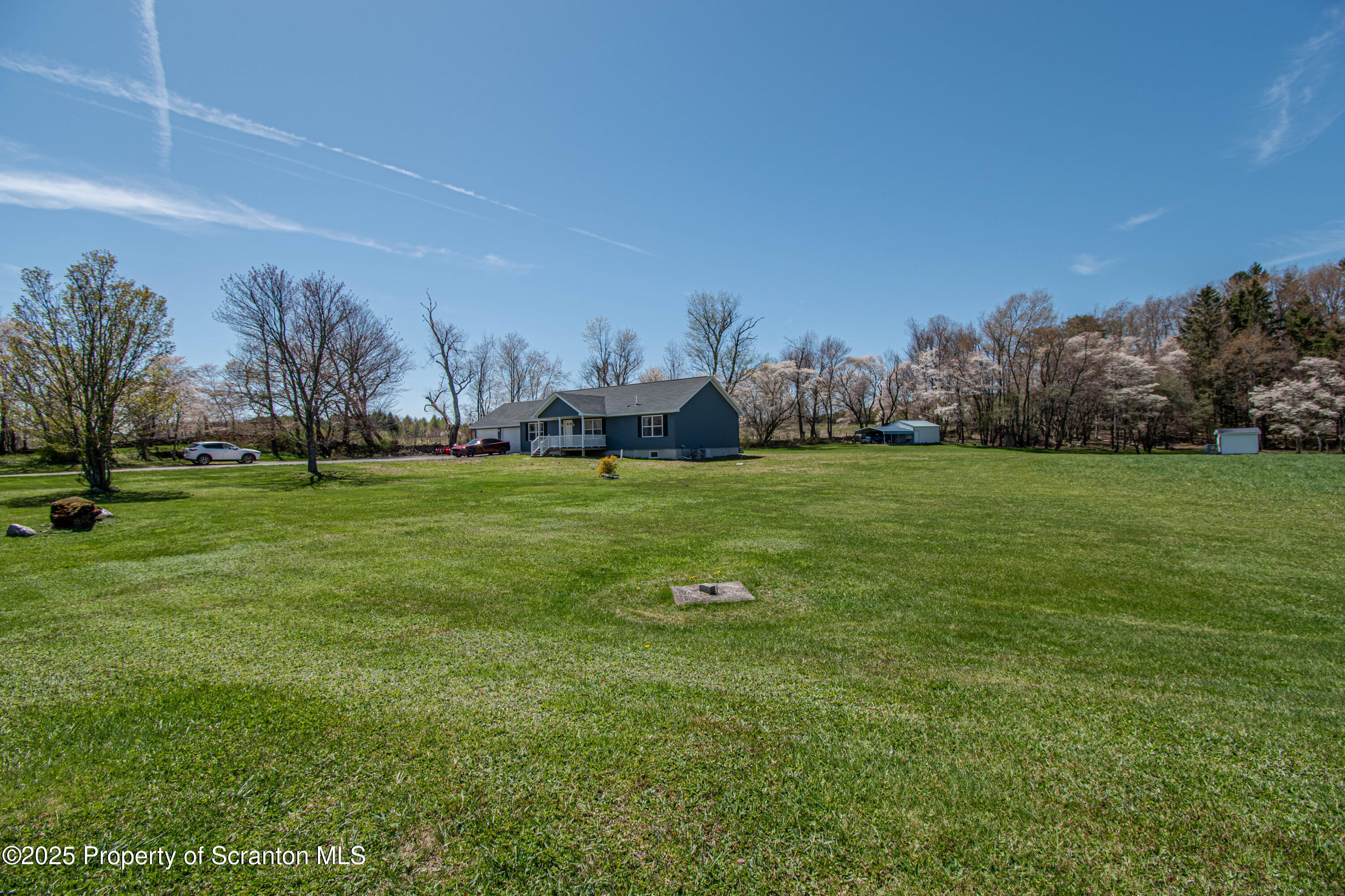 151 Sandy Banks Road Carbondale, PA 18407 - Photo 34 of 36 a view of a field with trees in the background
