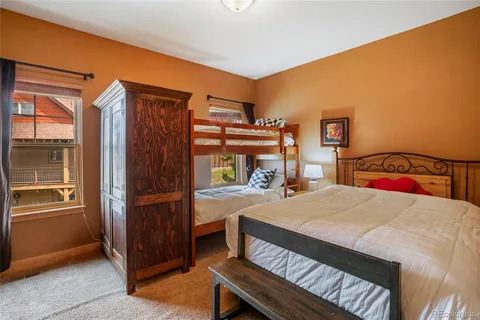 a bedroom with a bed and a table