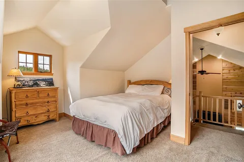 a bedroom with a bed and a cabinets
