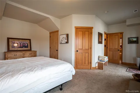 a bedroom with a bed and a view of bathroom
