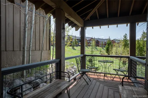 a view of two chairs in a balcony